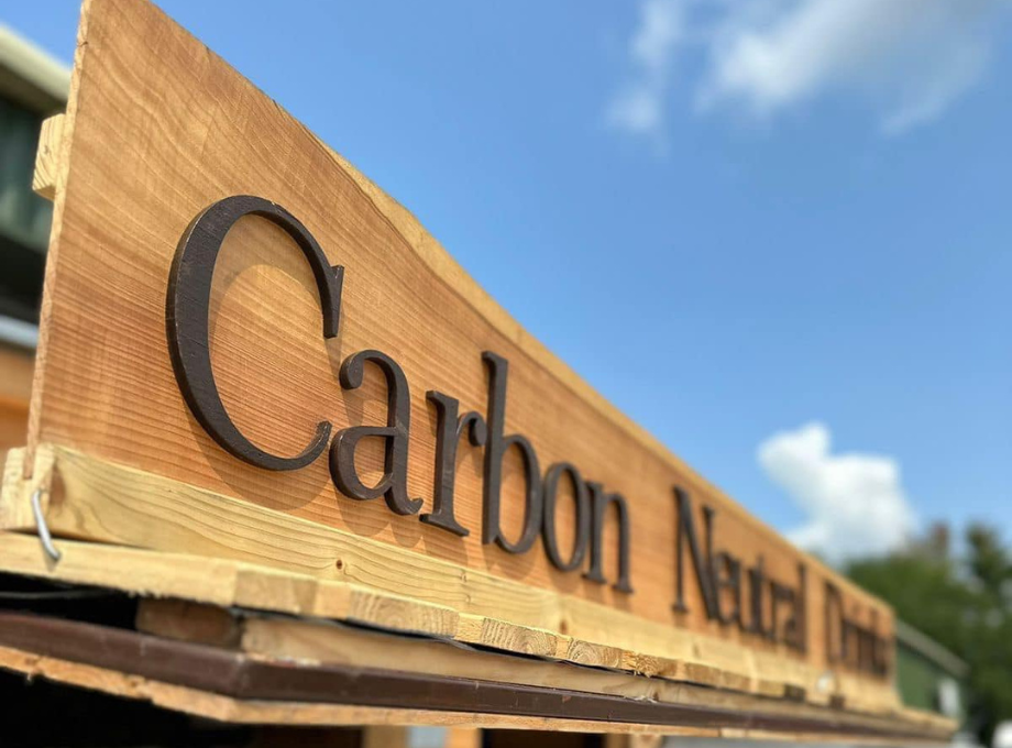 Close up of the Carbon Neutral Drinks Company's wooden sign