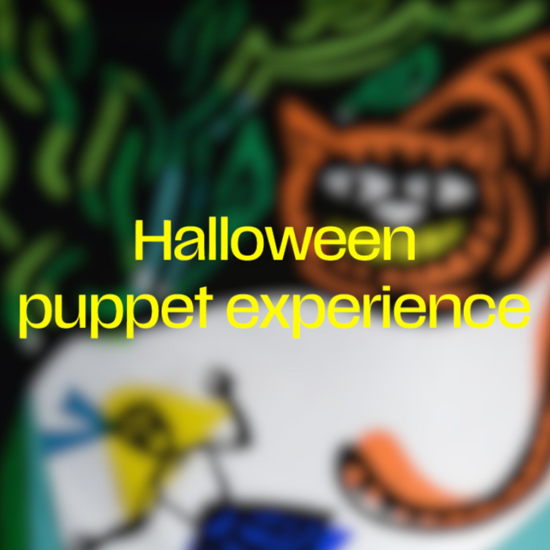 A colourful Halloween puppet experience graphic. The background shows abstract painted shapes of puppets of 'Down the rabbit hole' in green, orange, white, and blue, including a stylized cat face.